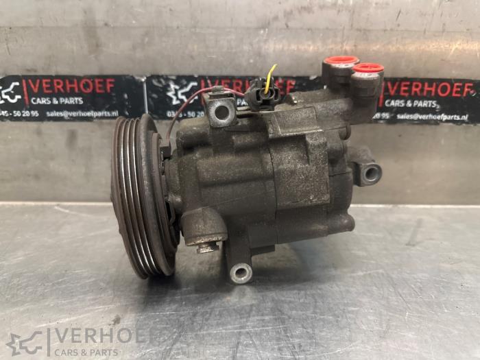 Usagé Compresseur de clim Nissan Note (E11) 1.4 16V Prix € 150,00 Règlement à la marge proposé par Verhoef Cars & Parts