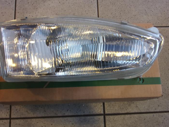 Headlight, right from a Mitsubishi Colt 1997