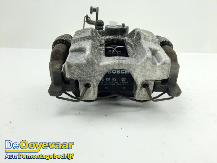 Rear brake calliper, left from a Peugeot 308 SW (L4/L9/LC/LJ/LR) 1.6 BlueHDi 120 2015