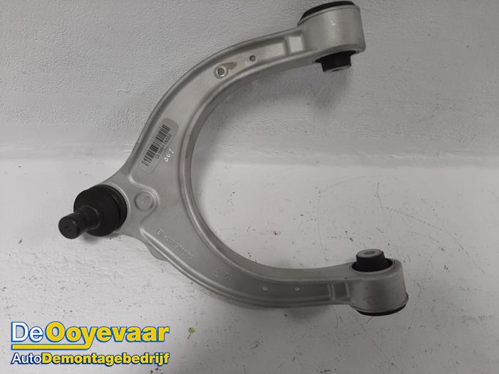 Front upper wishbone, left from a BMW 5 serie (G30) M550i xDrive 4.4 V8 32V TwinPower Turbo 2017