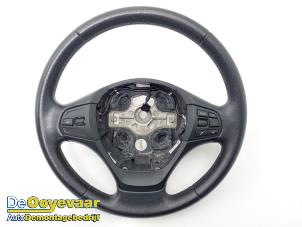 Used Steering wheel BMW 1 serie (F20) 114i 1.6 16V Price € 69,99 Margin scheme offered by Autodemontagebedrijf De Ooyevaar