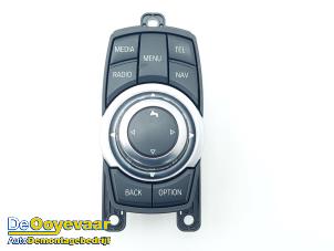 Used I-Drive knob BMW 1 serie (F20) 116i 1.6 16V Price € 49,99 Margin scheme offered by Autodemontagebedrijf De Ooyevaar