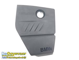 Used Engine cover BMW 1 serie (F20) 116i 1.6 16V Price € 29,99 Margin scheme offered by Autodemontagebedrijf De Ooyevaar