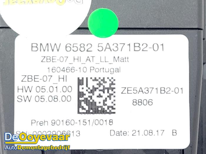 Commutateur MMI d'un BMW 1 serie (F40) 118i 1.5 TwinPower 12V 2021