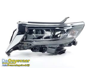 Used Headlight, left Toyota Land Cruiser (J15) 2.8 D-4D 16V Price € 999,99 Margin scheme offered by Autodemontagebedrijf De Ooyevaar