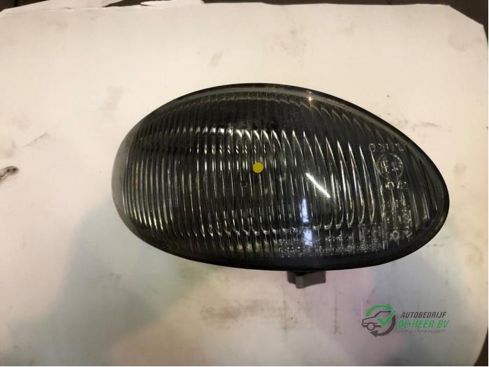 Fog light, front right from a Hyundai Coupe 2.0i 16V 1998