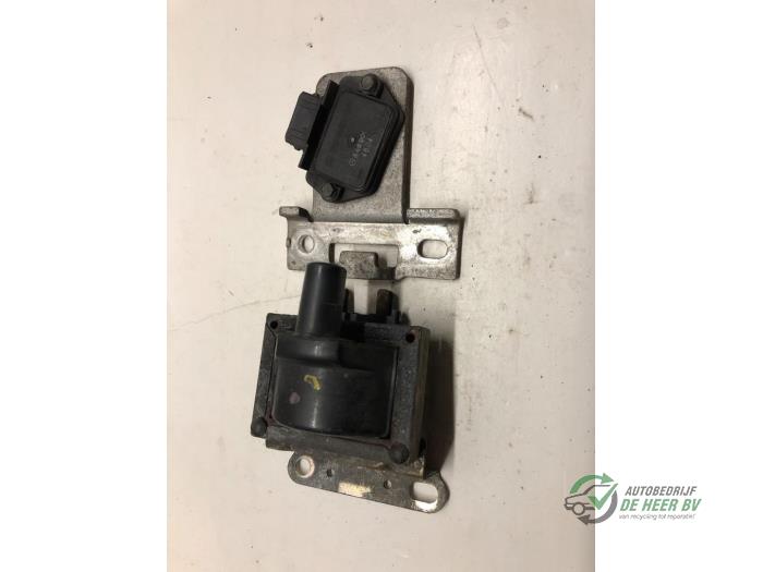 Ignition coil from a Opel Corsa B (73/78/79) 1.4i Swing,Joy,Sport,GLS 1995