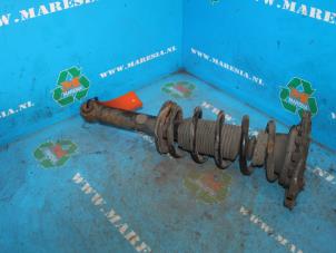 Used Rear shock absorber rod, left Nissan Almera (N16) 1.5 16V Price € 42,00 Margin scheme offered by Maresia Auto Recycling B.V.
