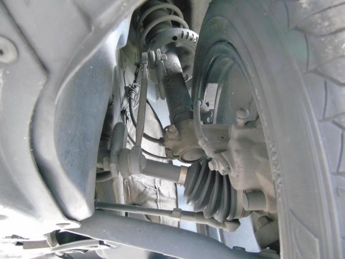 Eje de transmisión izquierda delante de un Volkswagen Polo V (6R) 1.2 TSI 16V BlueMotion Technology 2014