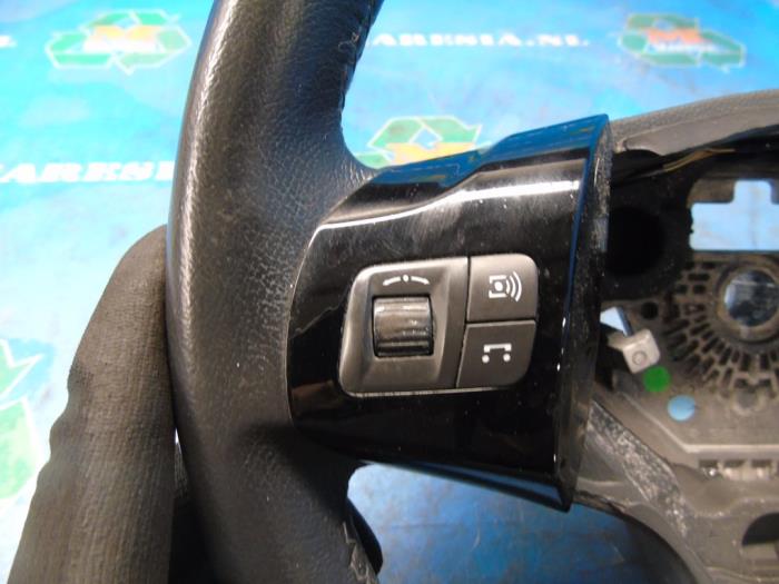 Steering wheel from a Opel Corsa D 1.4 16V Twinport 2011