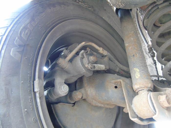 Rear brake calliper, left from a Kia Picanto (TA) 1.0 12V 2013