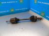 Front drive shaft, left from a Opel Astra J GTC (PD2/PF2), 2011 / 2018 1.4 Turbo 16V ecoFLEX 120, Hatchback, 2-dr, Petrol, 1.364cc, 88kW (120pk), FWD, A14NEL; B14NEL, 2011-10 / 2018-04 2012
