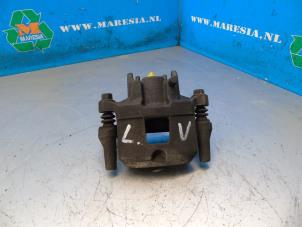 Used Front brake calliper, left Mitsubishi Space Star (A0) 1.0 12V Price € 52,50 Margin scheme offered by Maresia Auto Recycling B.V.