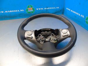 Used Steering wheel Nissan Micra (K13) 1.2 12V Price € 73,50 Margin scheme offered by Maresia Auto Recycling B.V.