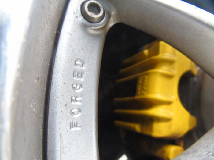 Rear brake calliper, left from a Volkswagen Scirocco (137/13AD) 2.0 TSI 16V 2014