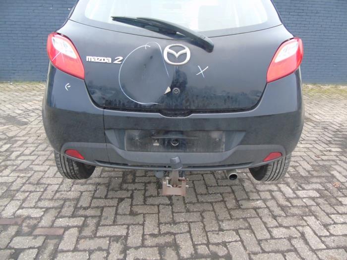 Używane Zderzak tylny Mazda 2 (DE) 1.3 16V S-VT High Power Cena € 131,25 Procedura marży oferowane przez Maresia Auto Recycling B.V.