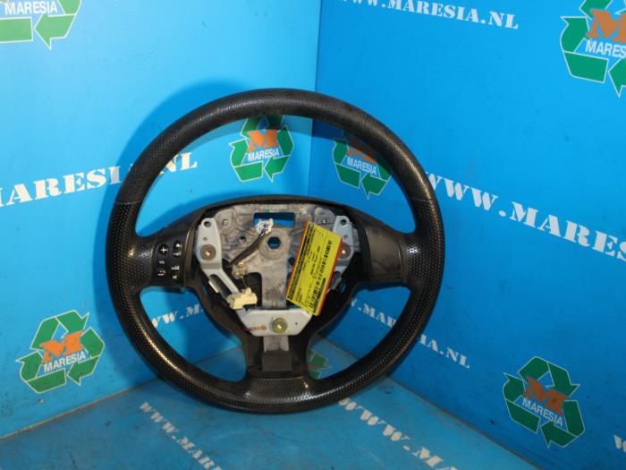 Begagnade Ratt Mazda 2 (NB/NC/ND/NE) 1.25 16V Pris € 78,75 Marginaltabell erbjuds av Maresia Auto Recycling B.V.