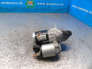 Anlasser van een Suzuki SX4 S-Cross (JY) 1.4 Booster Jet Turbo 16V SHVS 2021