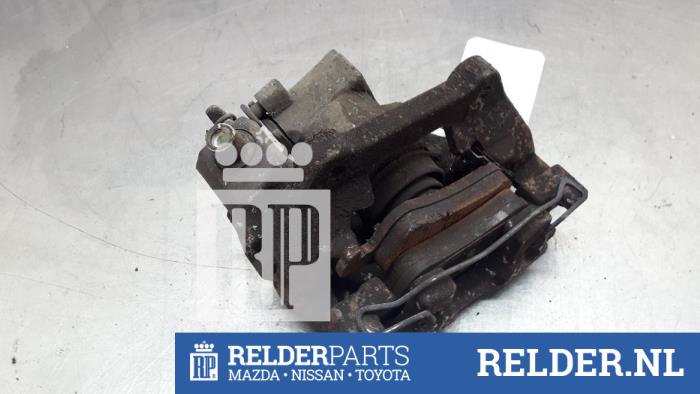 Rear brake calliper, left from a Toyota Yaris III (P13) 1.4 D-4D-F 2013