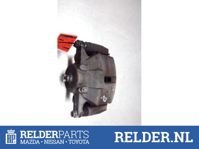 Pinza de freno derecha delante de un Nissan Qashqai (J11) 1.3 DIG-T 160 16V 2019