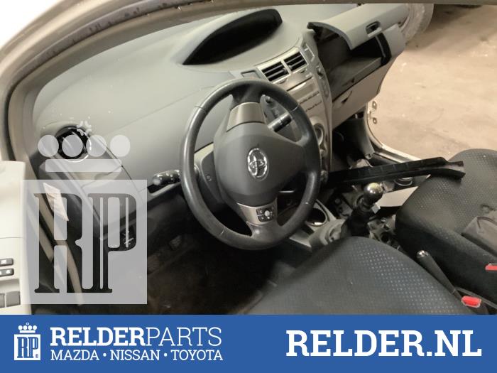 Knee airbag, left from a Toyota Yaris II (P9) 1.33 16V Dual VVT-I 2010