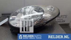 Używane Reflektor lewy Nissan Micra (K12) 1.2 16V Cena € 45,00 Procedura marży oferowane przez Relder Parts B.V.