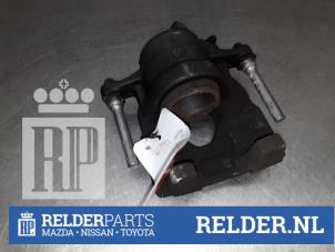 Used Front brake calliper, right Nissan Micra (K14) 1.0 IG-T 100 Price € 45,00 Margin scheme offered by Relder Parts B.V.