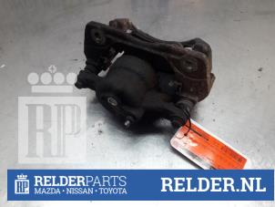 Used Front brake calliper, left Toyota Auris (E15) 1.4 D-4D-F 16V Price € 30,00 Margin scheme offered by Relder Parts B.V.