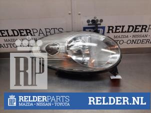 Używane Reflektor lewy Nissan Micra (K12) 1.2 16V Cena € 40,00 Procedura marży oferowane przez Relder Parts B.V.