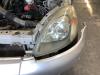 Headlight, left from a Toyota Yaris (P1) 1.0 16V VVT-i 2000