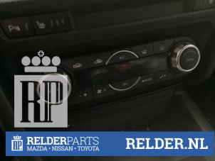 Używane Panel sterowania nagrzewnicy Mazda 3 (BM/BN) 2.0 SkyActiv-G 16V Cena € 75,00 Procedura marży oferowane przez Relder Parts B.V.
