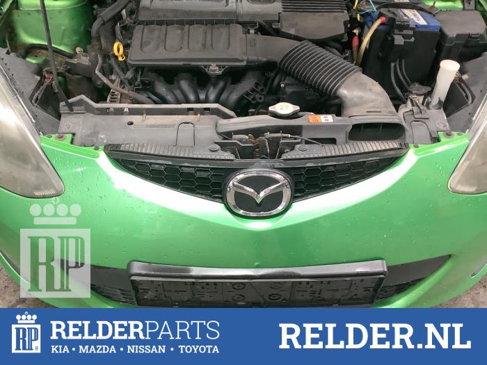 Używane Grill Mazda 2 (DE) 1.3 16V S-VT Cena € 50,00 Procedura marży oferowane przez Relder Parts B.V.