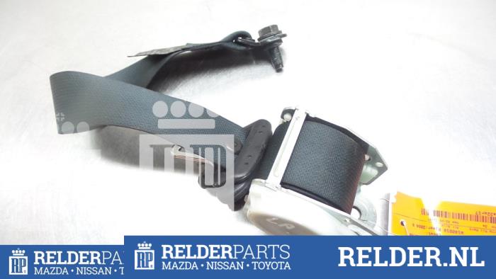 Rear seatbelt tensioner, left from a Nissan Almera (N16) 1.8 16V 2004