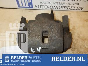 Gebrauchte Bremszange links vorne Mazda 323 (BJ12) 1.6 16V Preis € 45,00 Margenregelung angeboten von Relder Parts B.V.