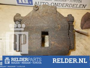Używane Zacisk hamulcowy prawy przód Nissan Almera (N16) 1.8 16V Cena € 25,00 Procedura marży oferowane przez Relder Parts B.V.