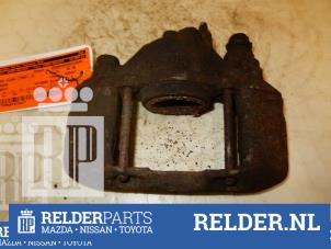 Used Front brake calliper, left Mazda Demio (DW) 1.5 16V Price € 45,00 Margin scheme offered by Relder Parts B.V.