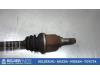Front drive shaft, left from a Nissan Micra (K12) 1.0 16V 2005