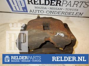Used Front brake calliper, right Nissan Primera Estate (WP11) 1.6 GX 16V Price € 45,00 Margin scheme offered by Relder Parts B.V.