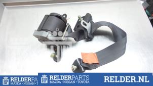 Used Rear seatbelt tensioner, left Mazda 323 C (BA13) 1.5i 16V Price € 27,00 Margin scheme offered by Relder Parts B.V.