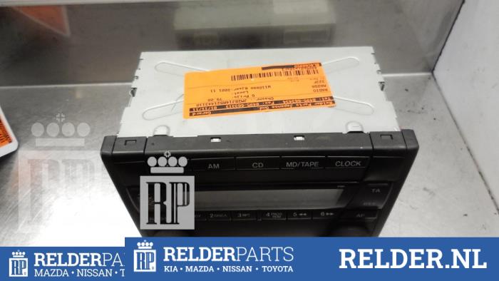 Używane Radio Mazda 323 Fastbreak (BJ14) 1.6 16V Cena € 68,00 Procedura marży oferowane przez Relder Parts B.V.