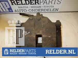 Used Front brake calliper, right Nissan Almera Tino (V10M) 2.0 16V CVT Price € 45,00 Margin scheme offered by Relder Parts B.V.