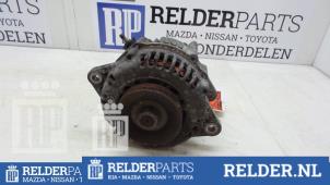 Dynamo van een Nissan Almera (N16) 2.2 Di 16V 2002