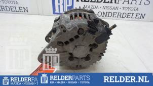 Dynamo van een Nissan Almera (N16) 2.2 Di 16V 2002