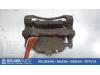 Front brake calliper, left from a Nissan X-Trail (T30) 2.5 16V 4x4 2003