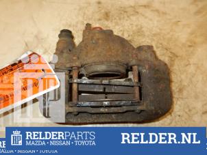Używane Zacisk hamulcowy prawy przód Mazda 121 (DB) 1.3i LX 16V Cena € 45,00 Procedura marży oferowane przez Relder Parts B.V.