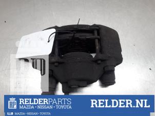 Gebrauchte Bremszange links vorne Mazda 323 C (BA13) 1.5i 16V Preis € 45,00 Margenregelung angeboten von Relder Parts B.V.