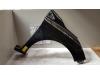 Front wing, right from a Renault Clio IV (5R) 1.5 Energy dCi 90 FAP 2013