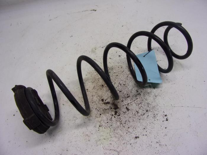 Rear coil spring from a Renault Laguna III (BT) 2.0 dCi 16V 150 2008