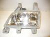 Fog light, front left from a Mazda 323 2002
