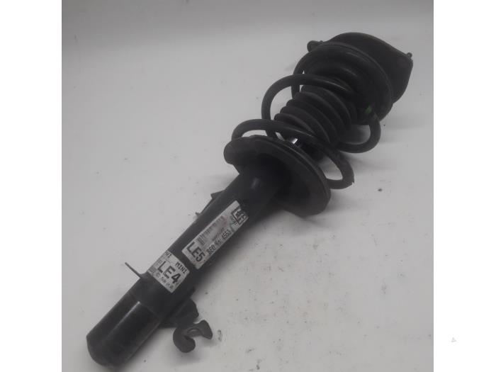 Fronts shock absorber, left from a MINI Mini One/Cooper (R50) 1.6 16V Cooper 2003
